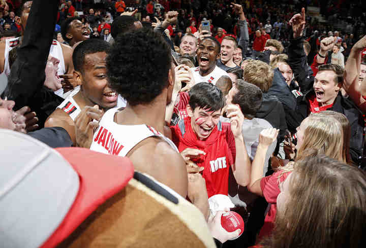 Students celebrate with players after storming the court following the Buckeyes' 80-64 victory against the Michigan State at Value  City Arena in Columbus.  (Joshua A. Bickel / The Columbus Dispatch)